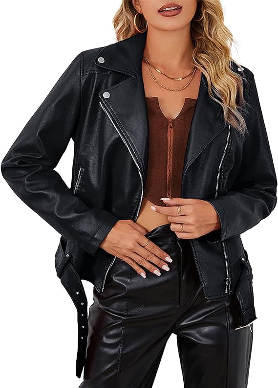 model wearing faux leather biker jacket with belt on bottom and leather pants