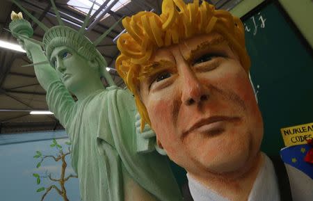 A papier mache caricature depicting U.S. President Donald Trump is pictured during preparations for the upcoming Rose Monday carnival parade in Cologne, Germany, February 21, 2017. REUTERS/Wolfgang Rattay