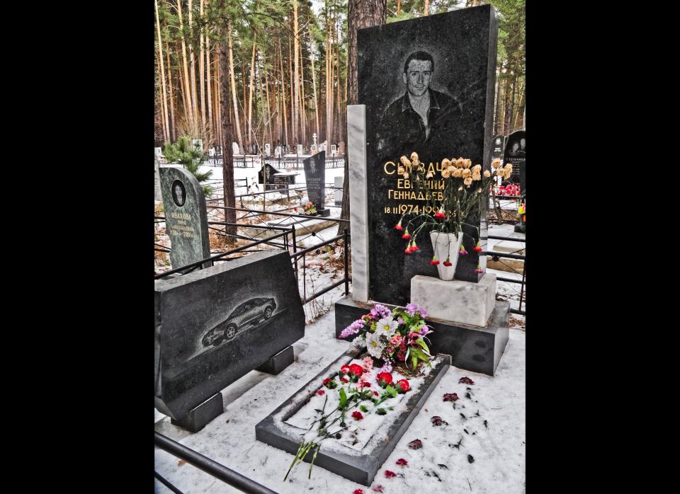 In Russia it would seem showing off with bling and swag is not restricted to the living.    In the graveyards of Yekaterinburg, <a href="http://www.cheapflights.com/flights-to-russia/" target="_hplink">Russia</a> criminal gang members are immortalized with life-sized grandiose depictions of themselves carved onto huge blocks of imported marble. Full of symbolism, bosses are shown dressed in expensive suits and gangsters are pictured holding keys to luxury cars. One fellow went so far as to have a separate grave for his car!    During the 1990s, Yekaterinburg was a center of organized crime in Russia with two rival gangs fighting for control of the city — the Uralmash and the Centralniy.    The Uralmash buried their dead in the city’s northern cemetery and Centralniy in the west