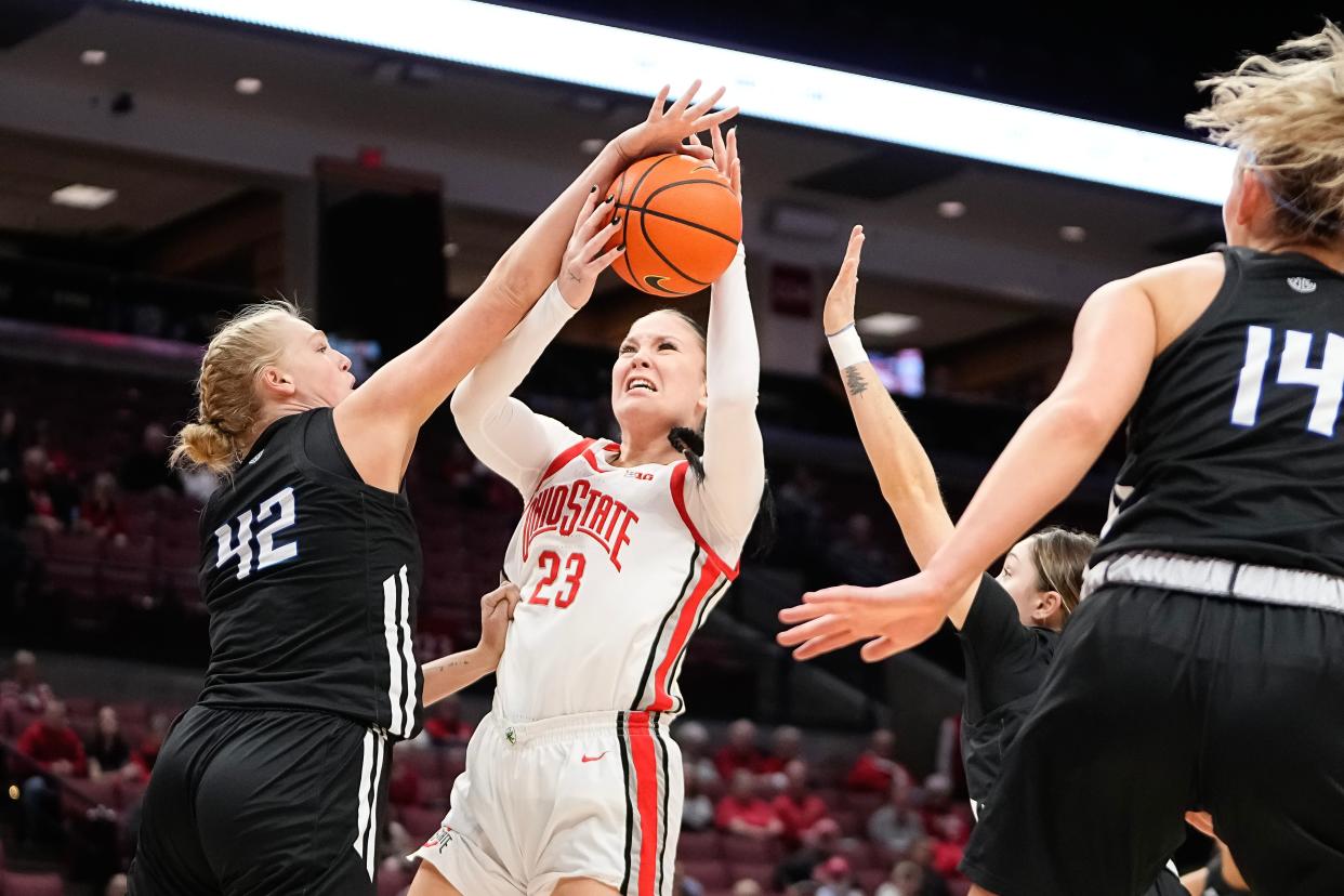 Dec 15, 2023; Columbus, Ohio, USA; Ohio State Buckeyes forward Rebeka Mikulasikova (23) gets fouled by Grand Valley State Lakers center Megan Crow (42) during the first half of the NCAA women’s basketball game at Value City Arena.