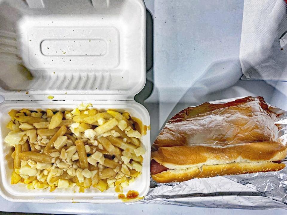 Polish sausage and poutine in the costco food court in Niagara Falls, Canada