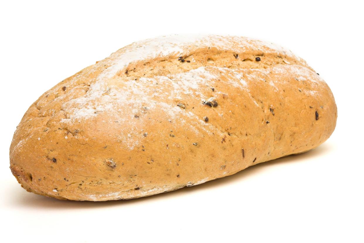 A loaf of potato bread made with real potatoes with a white background