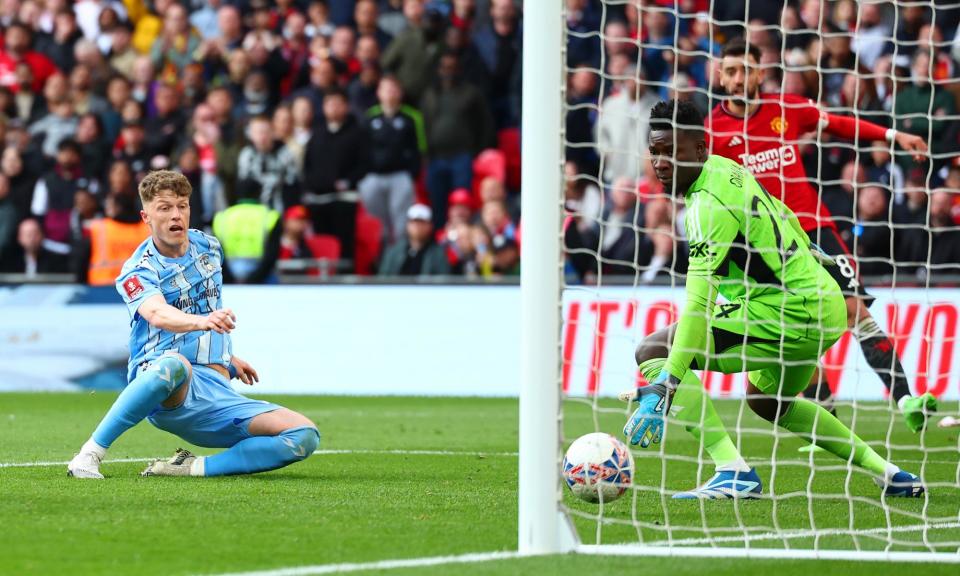 <span>Victor Torp slides in to score in the last minute of extra time, but his goal would be ruled out for an offside in the buildup.</span><span>Photograph: Chris Brunskill/Fantasista/Getty Images</span>