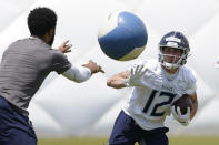 Tennessee Titans wide receiver Mason Kinsey (12) knocks a ball out of the way as he runs a drill during NFL football rookie minicamp Saturday, May 15, 2021, in Nashville, Tenn. (AP Photo/Mark Humphrey, Pool)