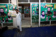 A man stands outside an election office of the newly formed political party Allah-o-Akbar Tehreek, in Lahore Pakistan July 14, 2018. Picture taken July 14, 2018. REUTERS/Mohsin Raza