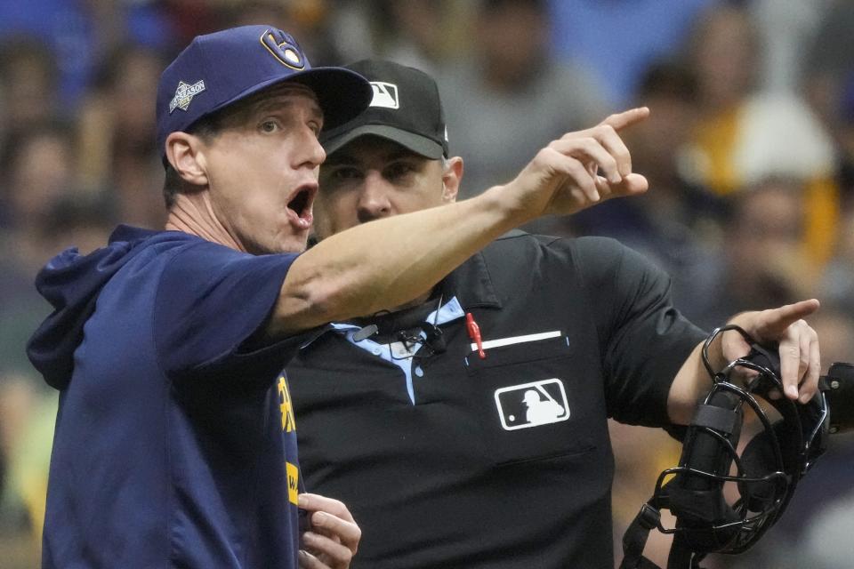 Milwaukee Brewers manager Craig Counsell argues withhome plate umpire Mark Ripperger during the fifth inning of a Game 1 of their National League wildcard baseball series against the Arizona Diamondbacks Tuesday, Oct. 3, 2023, in Milwaukee. (AP Photo/Morry Gash)