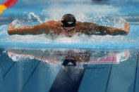 Caeleb Dressel, of the United States, swims in the men's 100-meter butterfly final at the 2020 Summer Olympics, Saturday, July 31, 2021, in Tokyo, Japan. (AP Photo/Gregory Bull)