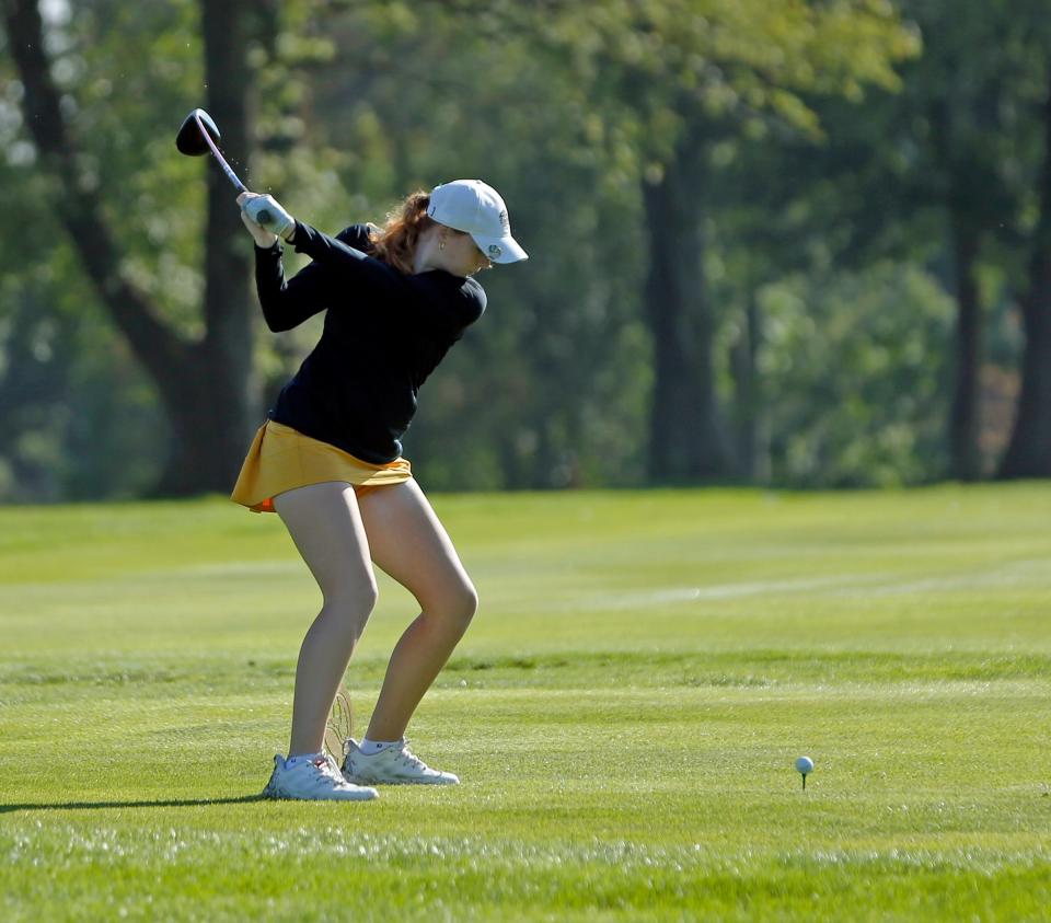Penn senior Delaney Wade hits a tee shot on the 6th hole during the IHSAA girls golf sectional tournament Friday, Sept. 15, 2023, at Knollwood Country Club in Granger.