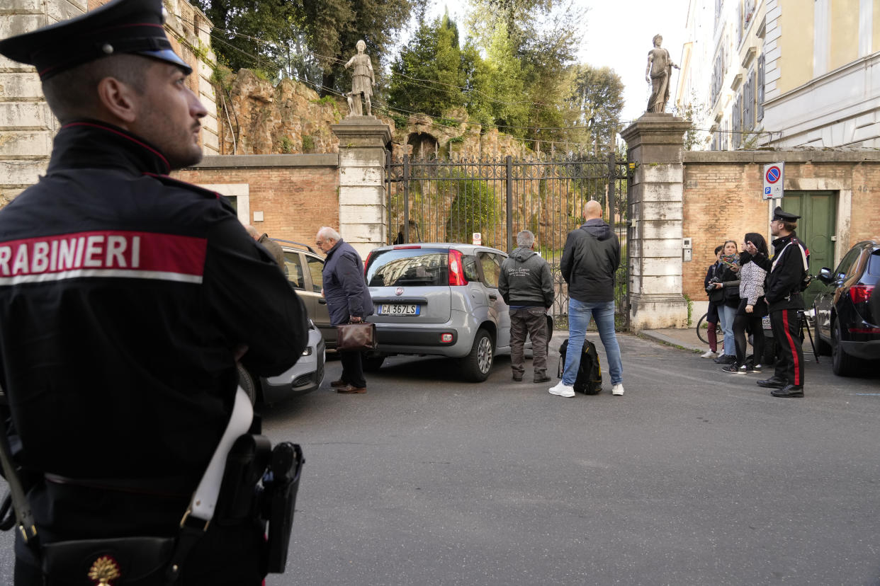 Carabinieri police officers stand in front of The Casino dell'Aurora, also known as Villa Ludovisi, as they execute an eviction order, in Rome, Thursday, April 20, 2023. Texas-born Princess Rita Boncompagni Ludovisi, who lives in the villa containing the only known ceiling painted by Caravaggio, is facing a court-ordered eviction Thursday, in the latest chapter in an inheritance dispute with the heirs of one of Rome's aristocratic families. (AP Photo/Andrew Medichini)