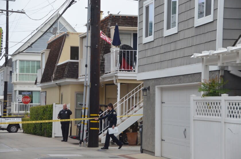 The back apartment behind utility pole is where the deaths occurred in 100 block of Diamond Avenue.