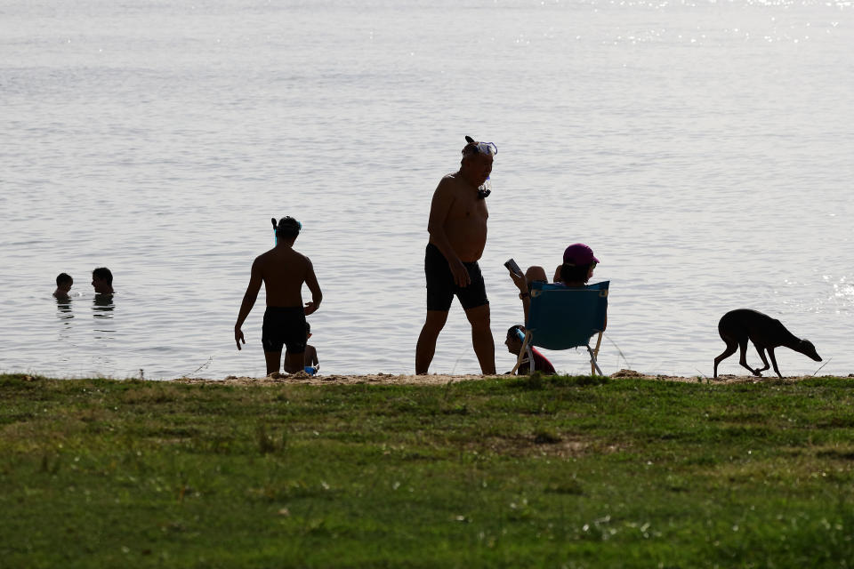 People relaxing by the beach at East Coast Park in Singapore.