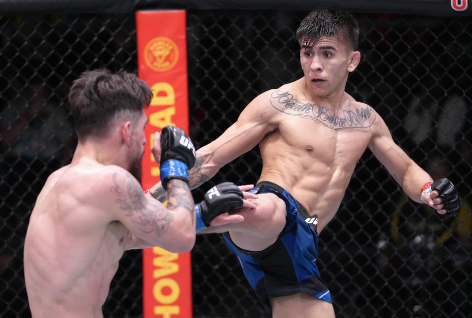 LAS VEGAS, NEVADA - FEBRUARY 19: (R-L) Mario Bautista kicks Jay Perrin in their bantamweight fight during the UFC Fight Night event at UFC APEX on February 19, 2022 in Las Vegas, Nevada. (Photo by Jeff Bottari/Zuffa LLC)