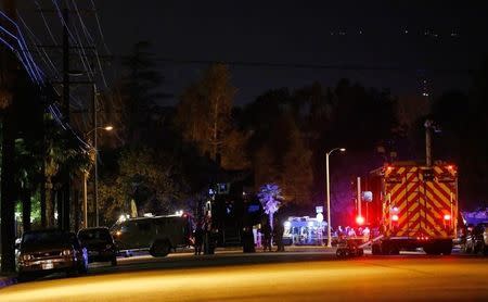 Police vehicles line the street outside the house of one of the suspects in a mass shooting in San Bernardino, California December 2, 2015. REUTERS/Mario Anzuoni