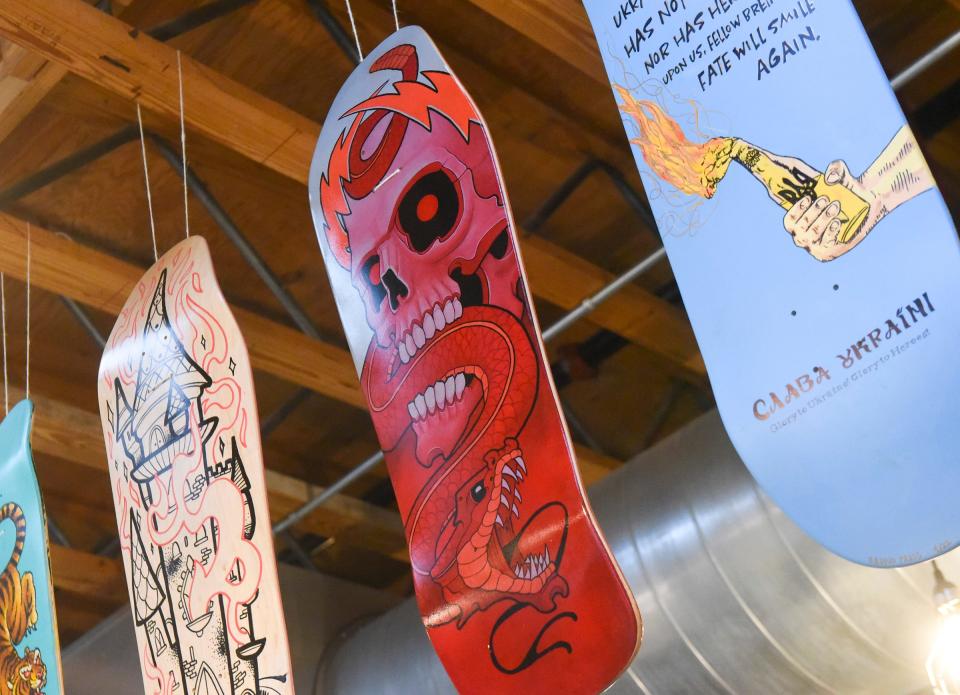 Skateboards hang from the rafters at Bad Habit Brewery in St. Joseph Wednesday, May 25, 2022. The boards are being auctioned off to raise money for the Skate Unity fundraiser.