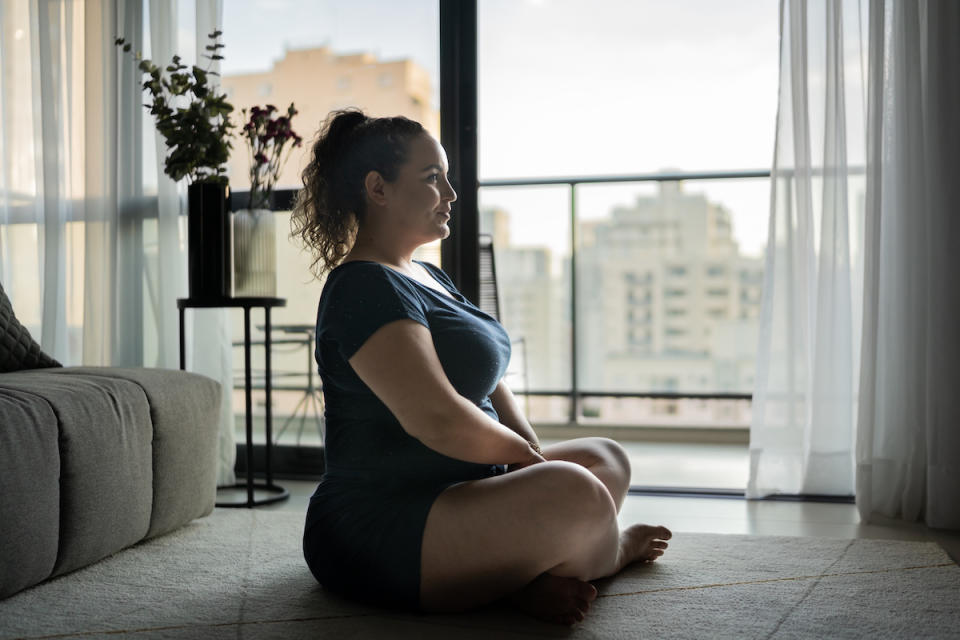 Woman meditating at home