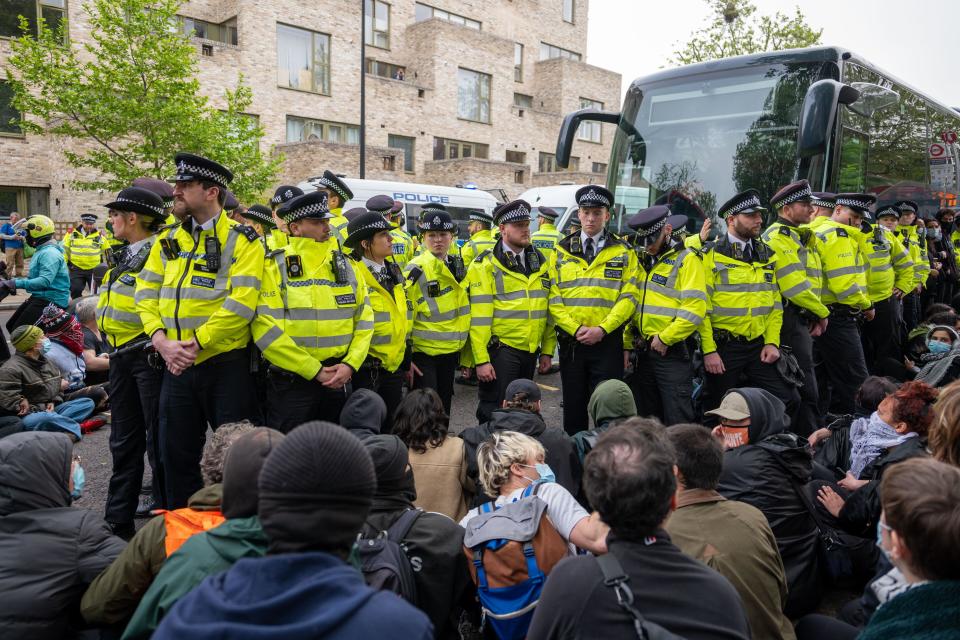 London / UK. 02 May 2024.  Protestors block High street in Peckham outside Great Western Hotel to prevent the removal of refugees to the Bibby Stockholm barge. (Alamy Live News / Aubrey Fagon)