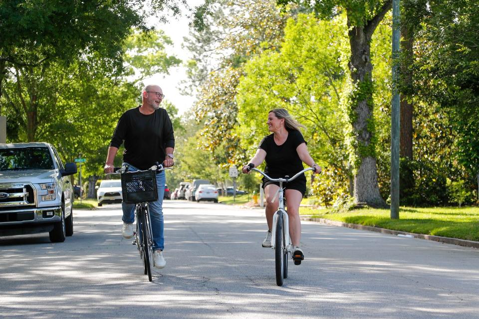 Harrison and Lauren Key ride their bikes together through their Savannah neighborhood.