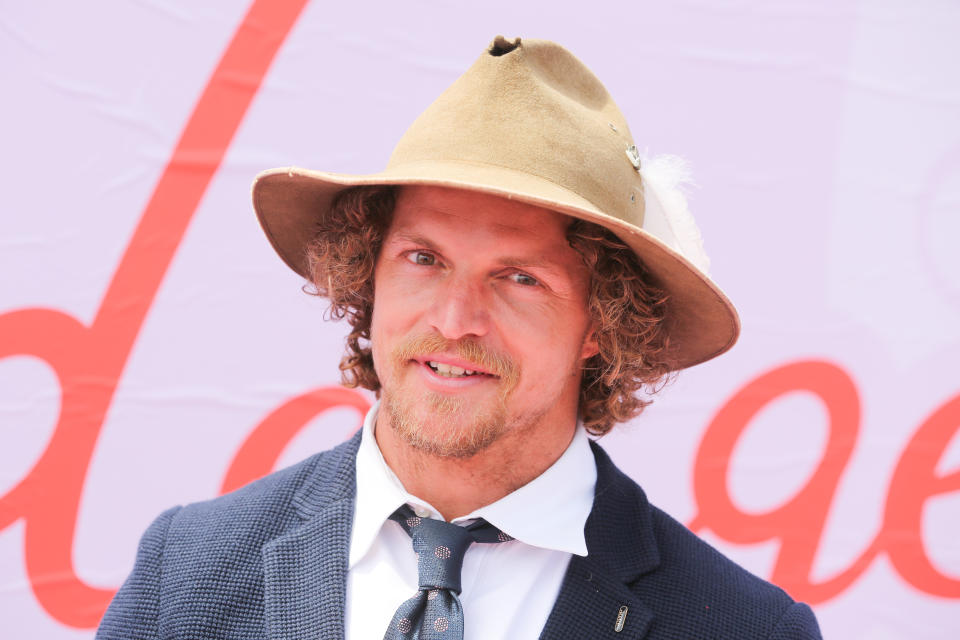 The Honey Badger Nick Cummins wears a battered Akubra hat and blue jacket and tie on Lexus Melbourne Cup Day at the 2019 Melbourne Cup Carnival at Flemington Racecourse in Melbourne Australia.