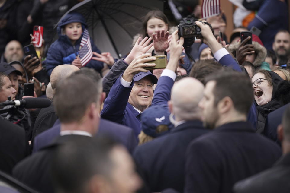 President Joe Biden takes a selfie while on a walkabout through Dundalk, County Louth, during his trip Ireland, Wednesday April 12, 2023. (Niall Carson/PA via AP)