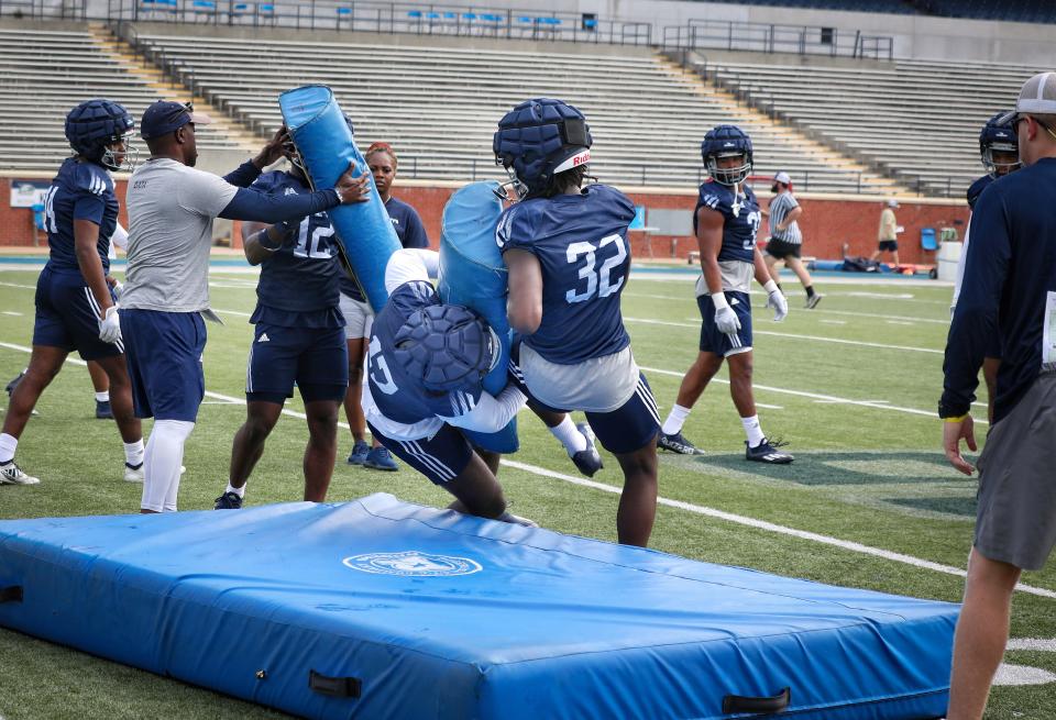 Georgia Southern defensive backs Kevin Speed (32) and Myzel Williams (17) collide during a drill on the first day of fall practice Aug. 3 at Paulson Stadium in Statesboro. The Eagles are having a free scrimmage and children's clinic on Saturday, Aug. 20, starting at 10 a.m. at Memorial Stadium.