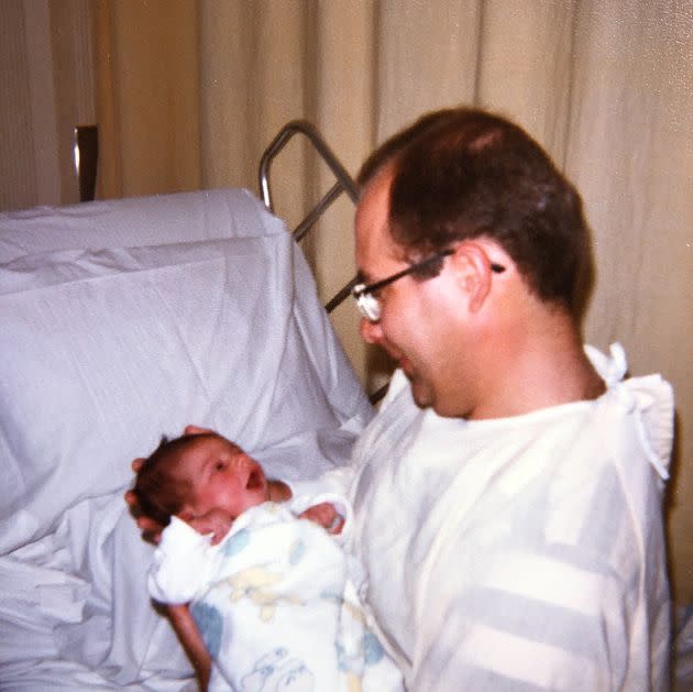 The author is pictured as a child with her father.