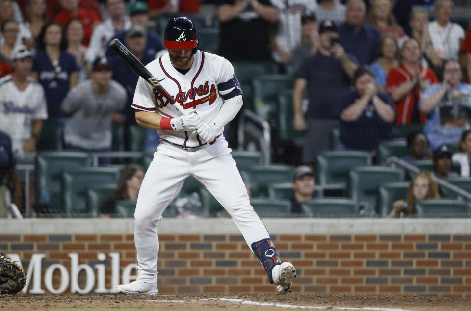 Atlanta Braves' Robbie Grossman earns a bases-loaded walk during the ninth inning of the team's baseball game against the Miami Marlins, driving in the winning run Saturday, Sept. 3, 2022, in Atlanta. (AP Photo/Bob Andres)