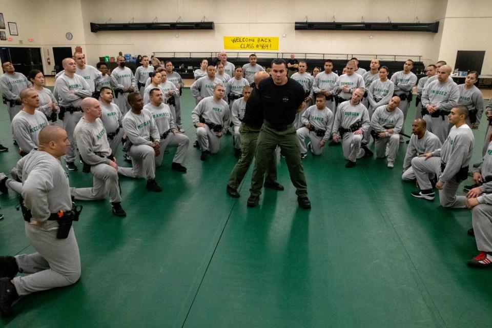 Instructors teach Los Angeles County Sheriff recruits in Class 464 how to physically control a person