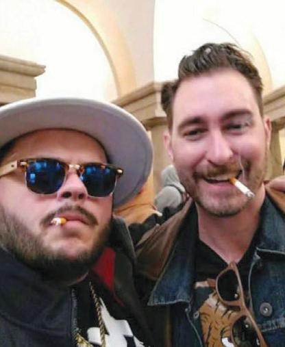 Nicholas DeCarlo, 32, of Fort Worth, Texas and Nicholas Ochs, 36, smoking inside the Capitol on Jan. 6, 2021. (DOJ)