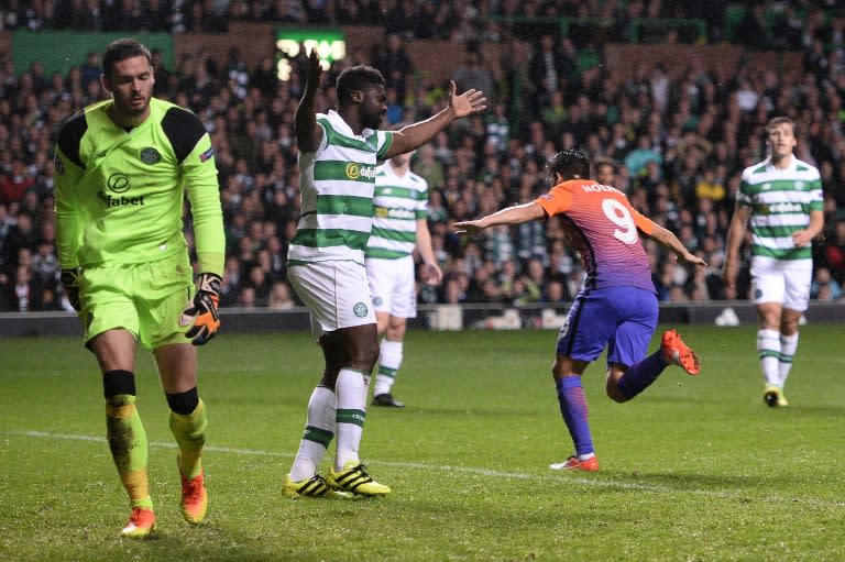 Manchester City's Spanish midfielder Nolito (2R) celebrates scoring his team's third goal during the UEFA Champions League Group C football match between Celtic and Manchester City