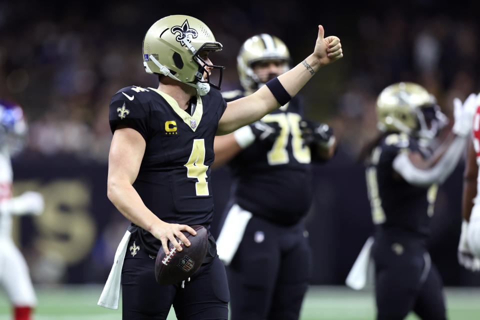 Dec 17, 2023; New Orleans, Louisiana, USA; New Orleans Saints quarterback <a class="link " href="https://sports.yahoo.com/nfl/players/27564" data-i13n="sec:content-canvas;subsec:anchor_text;elm:context_link" data-ylk="slk:Derek Carr;sec:content-canvas;subsec:anchor_text;elm:context_link;itc:0">Derek Carr</a> (4) gestures during the first half against the New York Giants at Caesars Superdome. Mandatory Credit: Stephen Lew-USA TODAY Sports