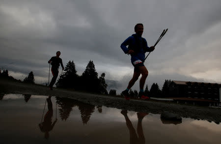 Competitors run in the Col de Voza during the 16th Ultra-Trail du Mont-Blanc (UTMB) race near Chamonix, France August 31, 2018. REUTERS/Denis Balibouse