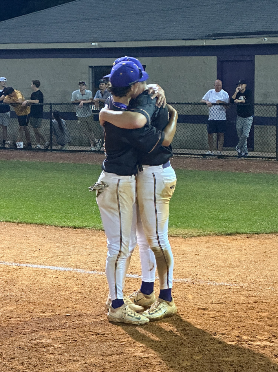 Clarksville's Kirk Weatherford hugs a teammate after the Wildcats clinched a TSSAA state tournament berth with a 5-0 win over Collierville.