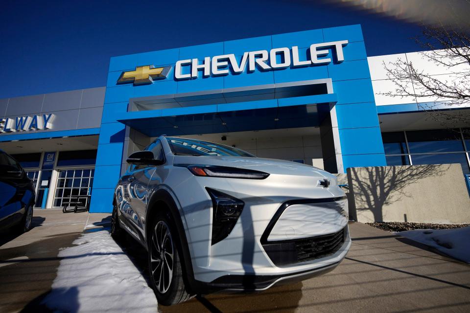 A lone, unsold 2022 Bolt electric vehicle sits on a lot at a Chevrolet dealership on Feb. 27, 2022, in Englewood, Colo.