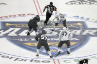 The puck is dropped for the start of the NHL All-Star hockey semifinal game between the Central Division and the Pacific Division Saturday, Jan. 25, 2020, in St. Louis. (AP Photo/Scott Kane)