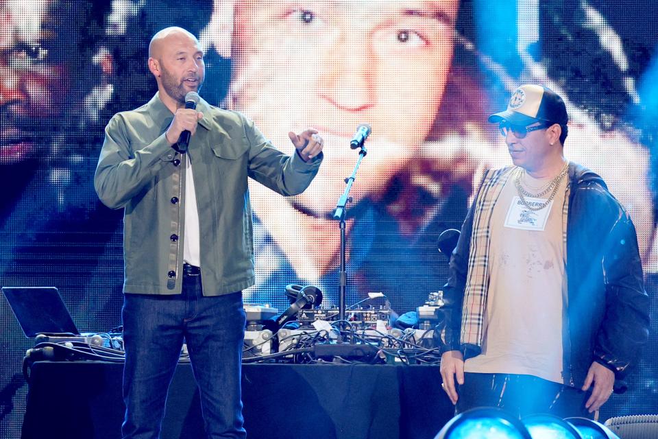 Derek Jeter and DJ Kid Capri speak onstage during Hip Hop 50 Live at Yankee Stadium on Friday in New York City.