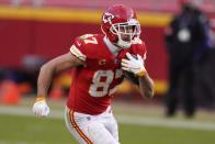 Kansas City Chiefs tight end Travis Kelce runs up field after catching a pass during the second half of an NFL divisional round football game against the Cleveland Browns, Sunday, Jan. 17, 2021, in Kansas City. (AP Photo/Charlie Riedel)