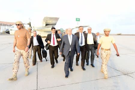 Yemen's exiled President Abd-Rabbu Mansour Hadi (C) walks at Aden airport upon his arrival from Saudi Arabia in this November 17, 2015 photo provided by the Yemeni Presidency. REUTERS/Yemen's Presidency/Handout via Reuters