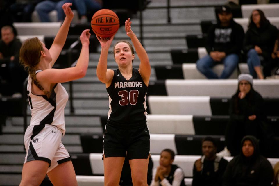 Holland Christian's Bria Lampen takes a three during a game against West Ottawa Friday, Dec. 2, 2022, at West Ottawa High School. 