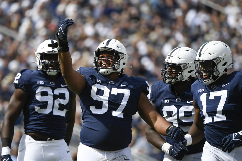 Penn State defensive tackle PJ Mustipher (97) celebrates after sacking Villanova quarterback Daniel Smith in the second quarter during an NCAA college football game in State College, Pa., on Saturday, Sept. 25, 2021. (AP Photo/Barry Reeger)