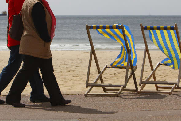 File photo dated 03/05/10 of two women walking along the beach in Bournemouth as one in 12 people planning to retire this year will still be paying off their mortgage. PRESS ASSOCIATION Photo. Issue date: Friday January 24, 2014. Prudential, which carries out research each year to gauge the state of people's finances as they approach retirement, found that one in six (17%) people ending their working lives in 2014 will still be burdened with some form of debt, including mortgages, credit cards or personal loans. Some 8% of those planning to retire in 2014 said they still have not fully paid off their mortgage and around 10% still have credit card debt piled up. On average, those who still have some form of mortgage and/or non-mortgage debt owe ?24,800, although this figure is around one fifth (21%) lower than the typical debt in 2013 of ?31,200, researchers found. Across Britain, Scotland had the highest rate of people retiring this year with debts outstanding. Nearly one quarter (24%) of people retiring in 2014 there said they would have some form of debt. See PA story MONEY Retire. Photo credit should read: Chris Ison/PA Wire