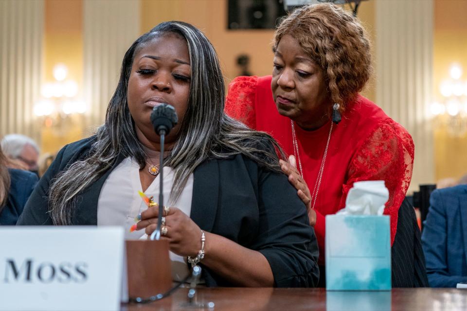 Wandrea "Shaye" Moss testifying to the House committee, while her mother, Ruby Freeman, comforts her.