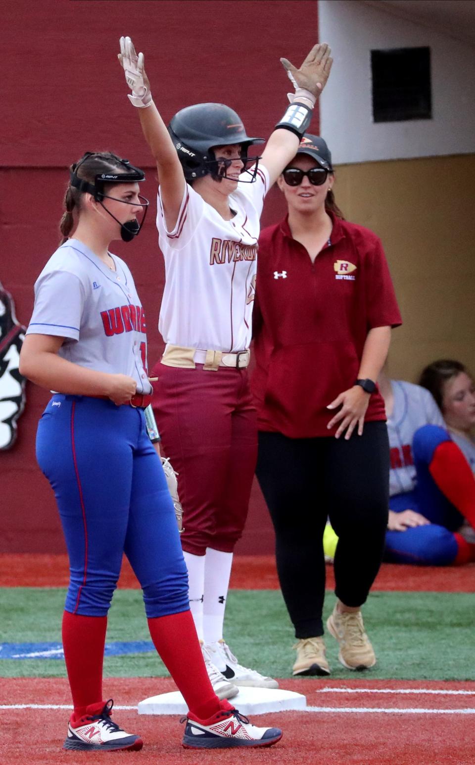 Riverdale's Morgan Sacharzyck (20) celebrates a base hit against Warren County during the Class 4A softball sectional on Friday, May 19, 2023, at Riverdale. 