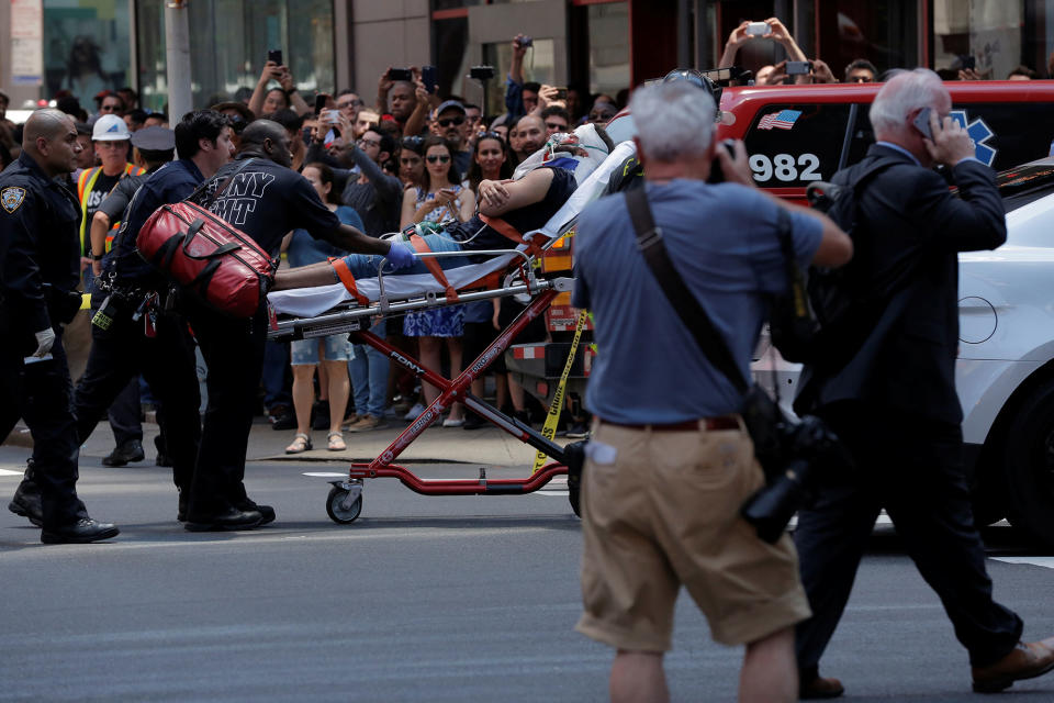 <p>First responders tend to an injured pedestrian after a vehicle struck pedestrians on a sidewalk in Times Square in New York on May 18, 2017. (Lucas Jackson/Reuters) </p>