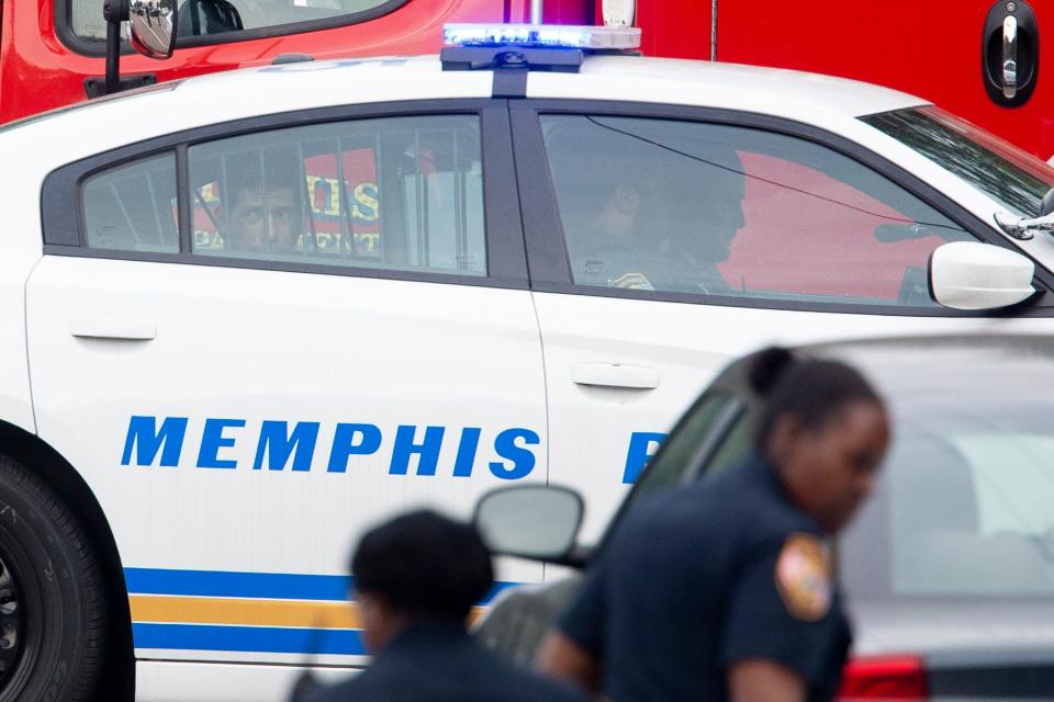 A man sitting in the back of a Memphis Police Department vehicle looks out the window before being driven away after MPD responded to a “barricade situation” just south of Bartlett on Wednesday, September 20, 2023.