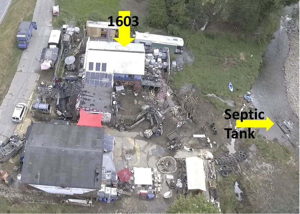 Buncombe County commissioners voted May 21, 2024, to demolish two structures, one of which had a septic tank floating in water that feeds the Town of Weaverville's drinking water supply.