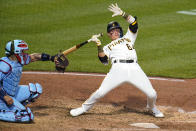 Pittsburgh Pirates' Diego Castillo (64) gets out of the way of an inside pitch from St. Louis Cardinals relief pitcher Drew VerHagen during the fifth inning of a baseball game in Pittsburgh, Saturday, May 21, 2022. (AP Photo/Gene J. Puskar)