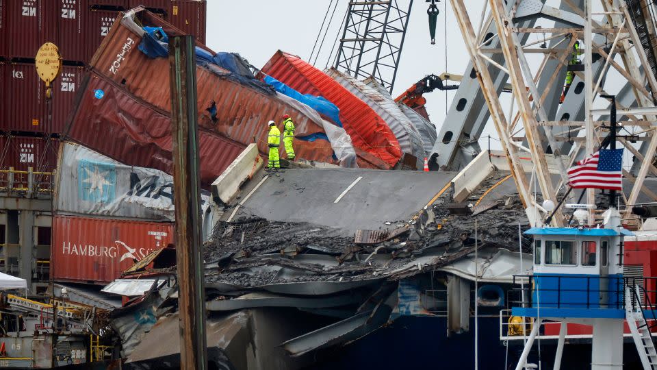 Salvage crew members work on the deck of the cargo ship Dali on Friday, May 10, 2024. - Kevin Dietsch/Getty Images