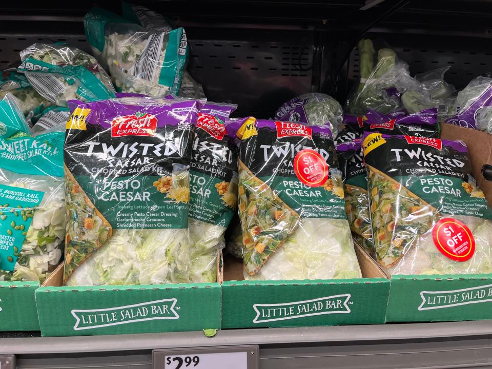 Bags of Fresh Express pesto-caesar-salad kits.