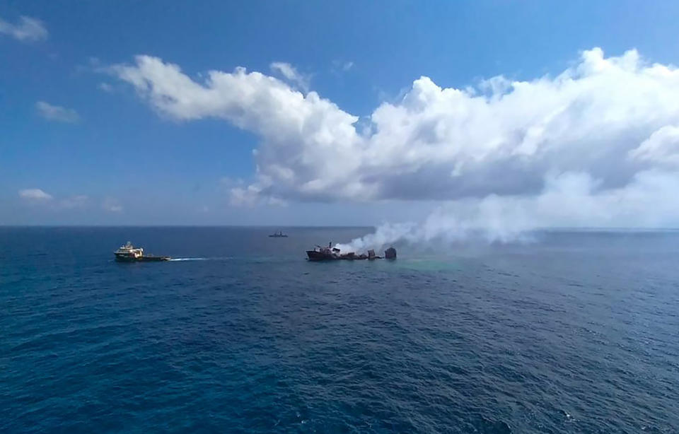 This photo provided by Sri Lankan Air Force shows the sinking MV X-Press Pearl at Kapungoda where it is anchored off Colombo port, Sri Lanka, Wednesday, June 2, 2021. Salvage experts were attempting to tow the fire-stricken container ship that had been loaded with chemicals into the deep sea as the vessel started to sink Wednesday. Water submerged the MV X-Press Pearl's quarterdeck a day after firefighters extinguished a blaze that had been burning for 12 days. (Sri Lanka Air Force via AP)