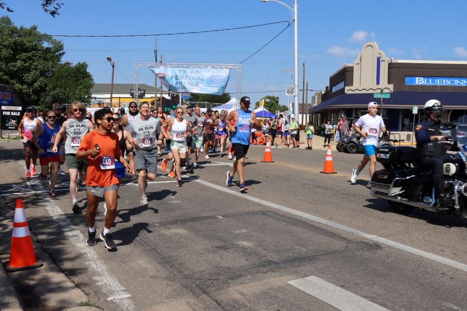 Participants start the run in the Fitness @ KT Black 5K Run, which was part of this year's Texas Route 66 Festival in Amarillo. Proceeds from Saturday morning's event will benefit Hope Lives Here.